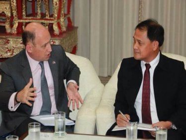 Governor Nisit (right) greets a British envoy yesterday