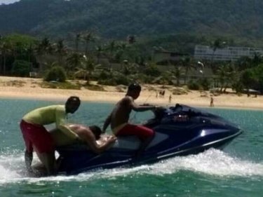 Lifeguards bring back the man cut by the propeller at Karon beach today