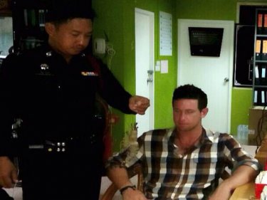 A policeman in Patong with the Aussie and the Phuket tiger prawns today