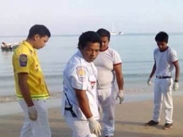 Rescue workers at Nai Yang beach, where a man's body was found today