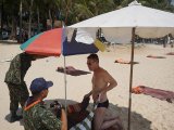 Phuket Officials Seize 50 Beach Umbrellas from Tourists at Surin