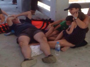 Hoping for good news: The Israeli girl's family on shore in Krabi tonight