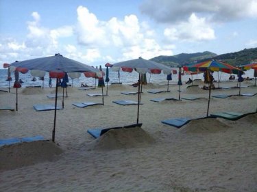 Umbrellas and mats expand outside the 10 percent zone at Phuket's Patong