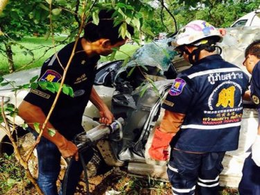 Rescuers at the scene of the crash that killed a man travelling to Phuket