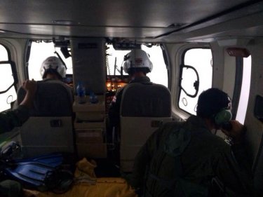 Pilots look for six missing people from a Navy 'copter off Phuket today