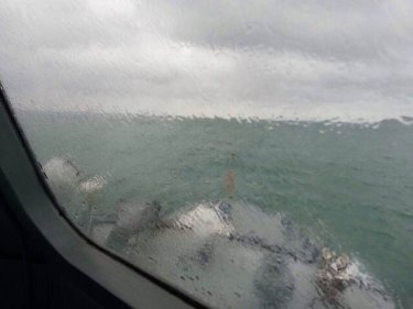 The grim view through monsoon storms leaves six sailors still lost off Phuket