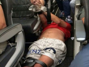 Other passengers subdued a troublemaker on a flight from Hong Kong
