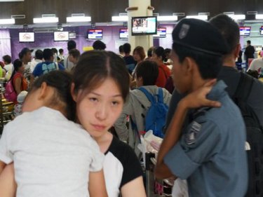 Crowds flock to the airport late at night when China flights depart