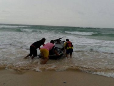 Would-be rescuers put a jet-ski to sea yesterday from Karon beach