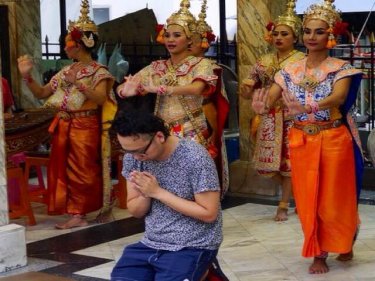 Dancers at Erawan Shrine in Bangkok yesterday