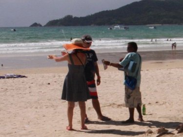 Touts on Patong beach offer all kinds of services, including jet-ski rides
