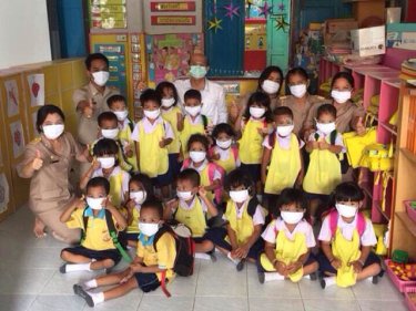 Children at a Phuket school don masks for their safety in the haze