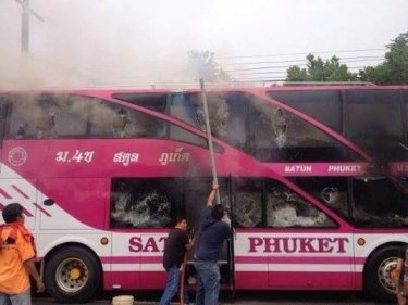 Rescuers try to free passengers from the burning bus this week