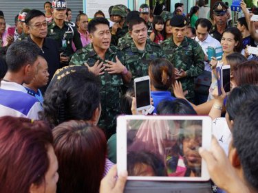 Baan Don villagers listen at ''peace talks'' after the disturbing Phuket riot