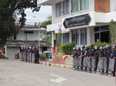Riot police ready for trouble at Thalang on Phuket yesterday