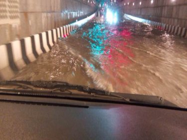 Water coursing through Phuket's Central Festival underpass about dawn