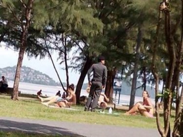 Get 'em on: Police tell three bikini girls to stop sunbaking on Phuket