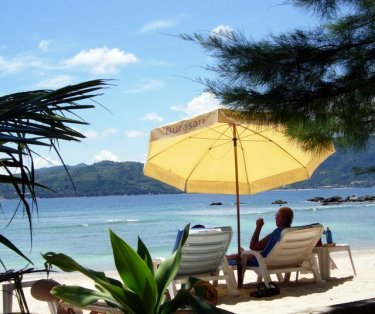 This side of Paradise. The restaurant is good and the view across to Patong makes this small beach a great place to be.