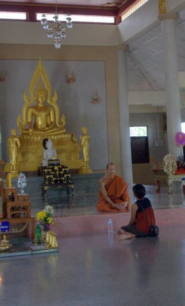 The lone monk counsels a worshipper at Sumnuksong Para. Visitors are welcome and will receive some useful advice in English.