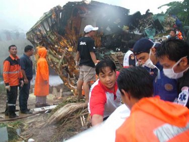 Rescuers at work while Flight 269 smoulders on crash-landing