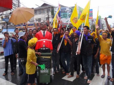 Phuket protestors with an effigy of the PM on Saturday