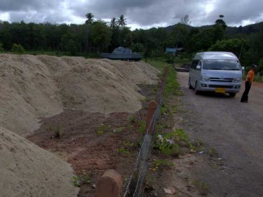 Piles of sand obscure Phang Nga's best-know tsunami attraction