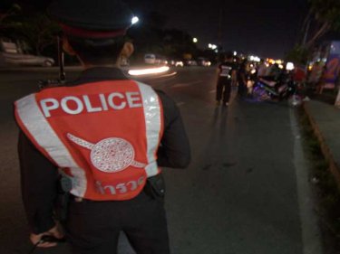Police wave down motorists at the Phuket City checkpoint