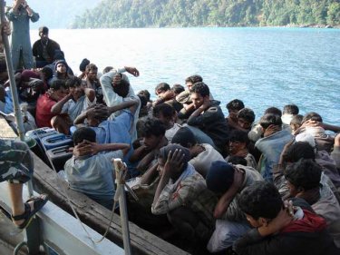 Boat people under arrest earlier in December north of Phuket