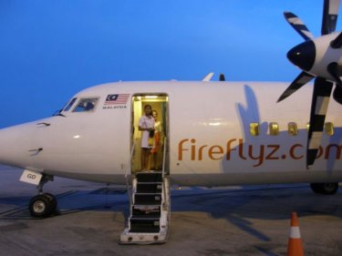 A Firefly passenger from Phuket about to alight in Penang