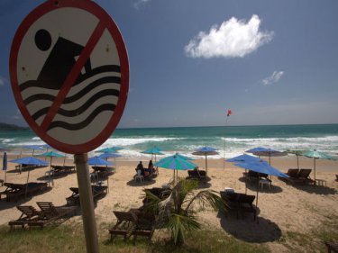 Warning sign at Surin beach, where one of four swimmers drowned