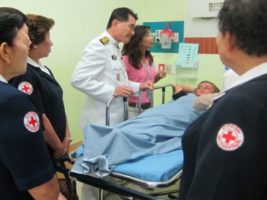 Phuket Governor Wichai Praisa-ngob visits a young crash survivor in hospital