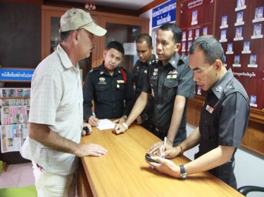 Police at Patong talk to the mysterious 'Dean Mancuso'