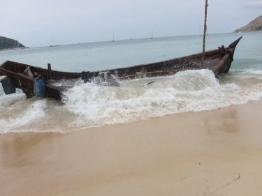 The vessel that carried more than 90 boatpeople to land on a Phuket beack