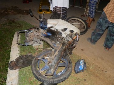 The crashed motorcycle at the scene of the double fatality last night