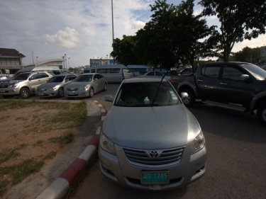 A crush of taxis and limousines leaves no room to park at Phuket airport