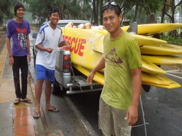 Back come Phuket's lifeguards, stacking skis at beaches in rain today