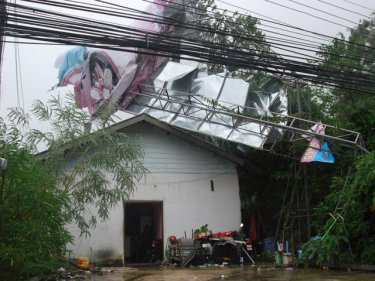 This large billboard blew over damaging a house and a second-hand car yard on the router towards Patong Hill from Phuket City