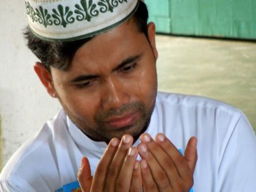 A tear falls at a Phuket mosque for less fortunate Rohingya in Burma