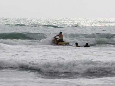 A rescue being carried out at Phuket's Patong beach today