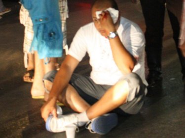 Tourist Ahmed Taha Taha stages a sit-down protest after the tuk-tuk assault