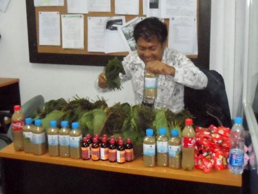 An officer with the drugs haul at Kathu Police Station in Patong yesterday