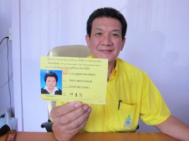 Phuket Land Transport Chief Teerayut Prasertpon shows new taxi ID