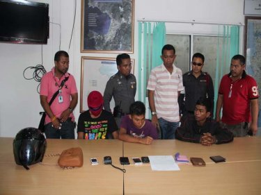 The gang members and stolen goods at Patong police station today