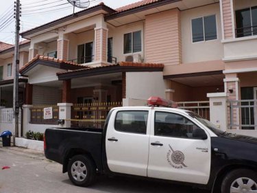 Police examine the Phuket City house where the murder took place
