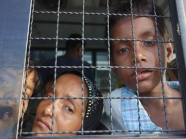 Rohingya boatpeople were quickly transferred to police trucks yesterday