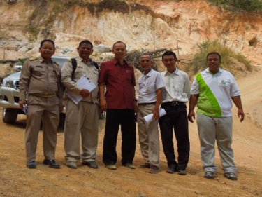 Vice Governor Somkiet with investigators on the steep slope site yesterday