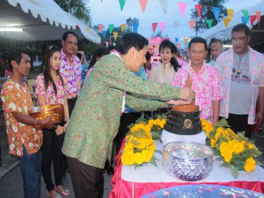Phuket Governor Maitree Intusut takes part in a traditional Songkran ceremony yesterday to pay tribute to Phuket's elderly