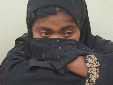 A Rohingya woman cries after her apprehension on Phuket