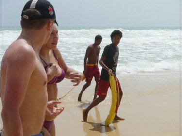 A woman is rescued at Surin beach on the day a Belgian and a Russian drowned. The photo album shows conditions at Surin and at Laem Singh