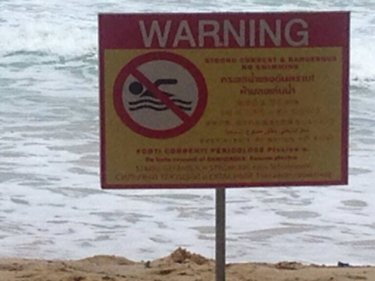 Multilingual sign being placed on Phuket beaches by lifeguards. The lifeguards say once determined swimmers reach the beach, it's often too late